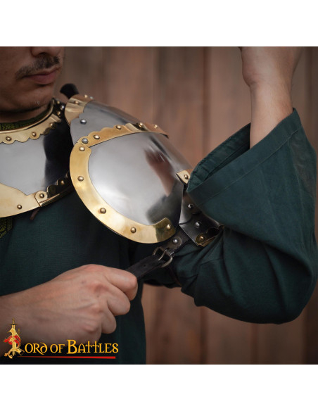 Medieval steel pauldrons with brass...