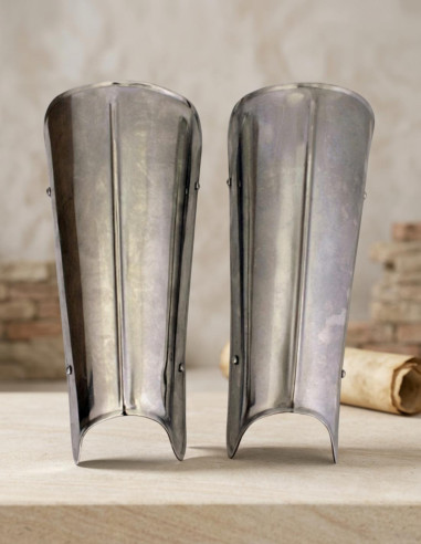 Metal greaves with straps