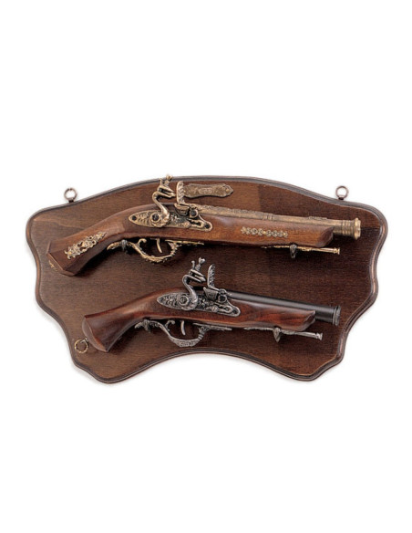 Wooden panoply with old pistols
