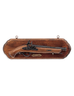 Wooden panoply with old pistol