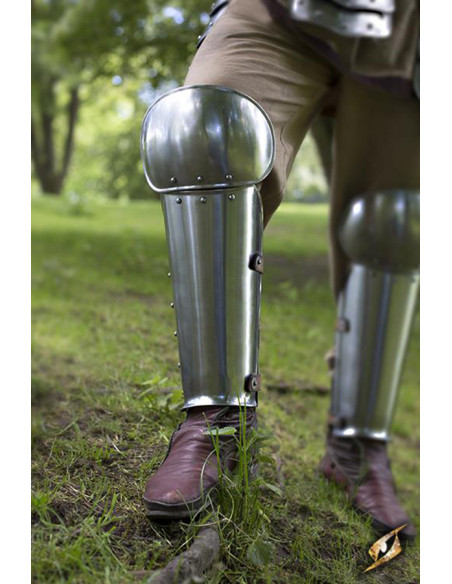 Metallic medieval greaves in polished...