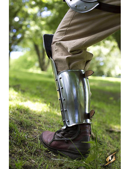 Metallic medieval greaves in polished...