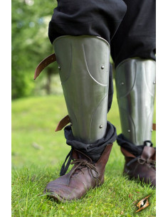 Medieval greaves of the King in polished steel