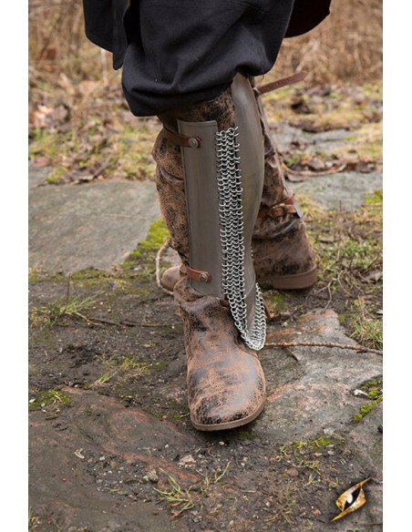 Persian greaves in polished steel