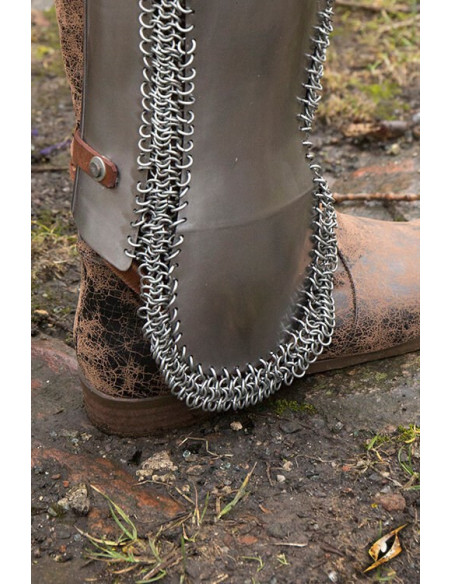 Persian greaves in polished steel