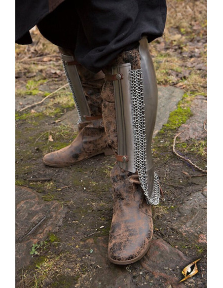 Persian greaves in polished steel