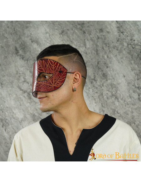Red leather mask with embossed maple...