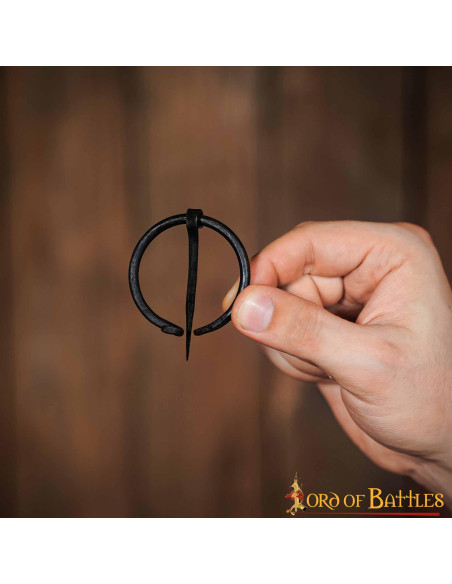 Medieval cape fibula in wrought iron