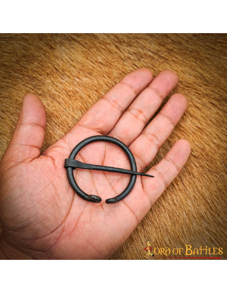 Medieval cape fibula in wrought iron