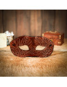 Brown leather mask with embossed maple leaf motifs