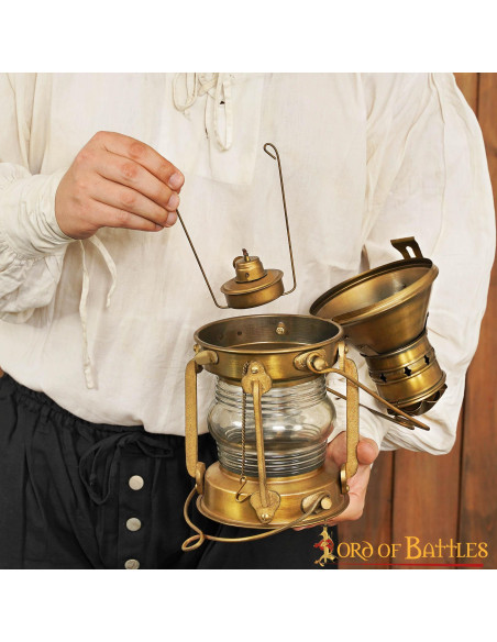 Medieval brass oil lamp (15.7x33 cm.)