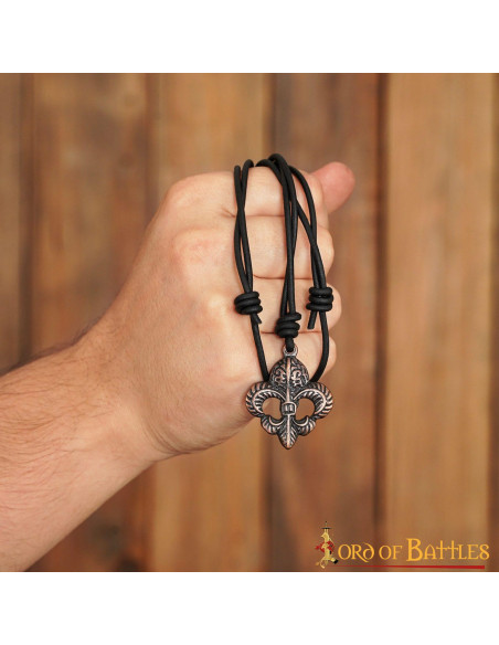Medieval pendant fleur de lis in aged...