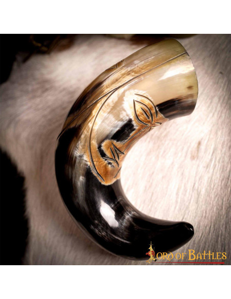 Medieval tribal face horn to drink...