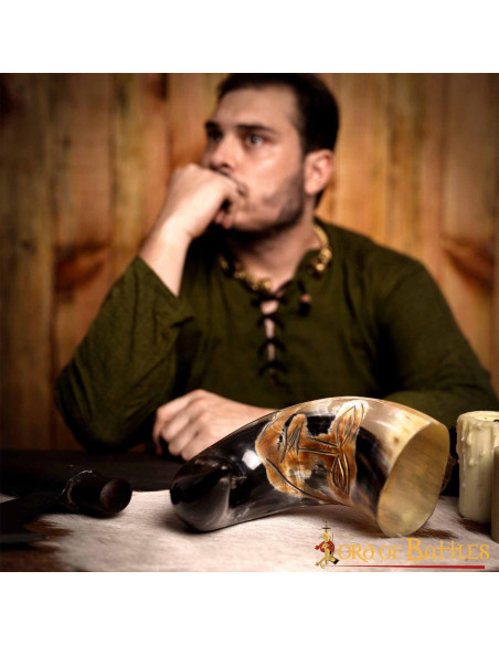 Medieval tribal face horn to drink...