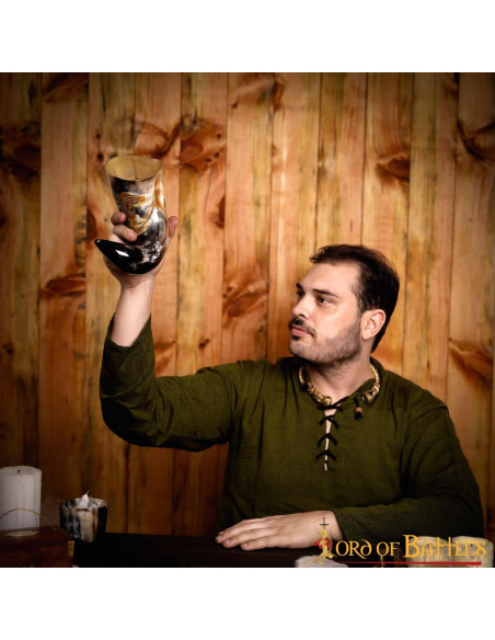 Medieval tribal face horn to drink...