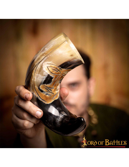 Medieval tribal face horn to drink...