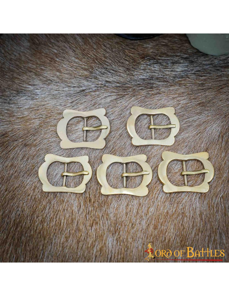 Set of 5 late middle age brass buckles