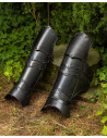 Medieval greaves in blackened steel. Vladimir model