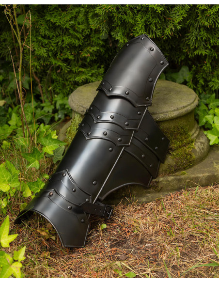 Medieval greaves in blackened steel....