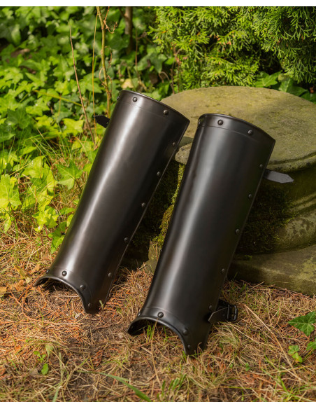 Medieval Jost greaves in blackened steel