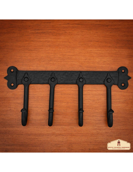 Rustic blackened cast iron wall coat...