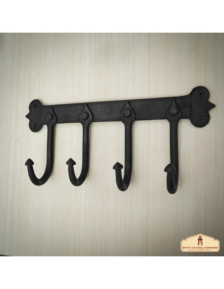 Rustic blackened cast iron wall coat...