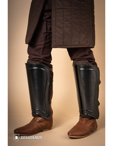 Medieval warrior greaves in burnished...