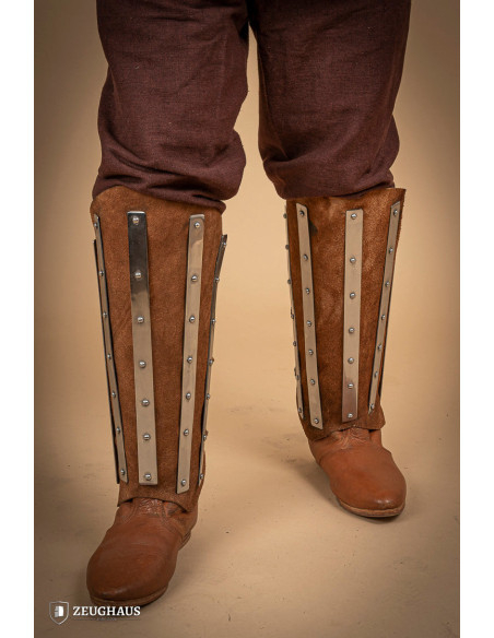 Medieval greaves in steel and split...