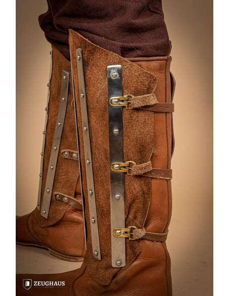 Medieval greaves in steel and split...