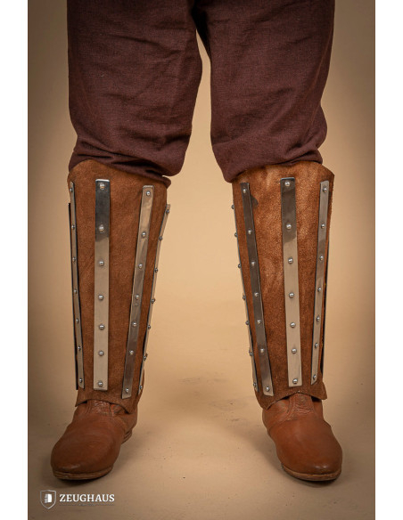 Medieval greaves in steel and split...