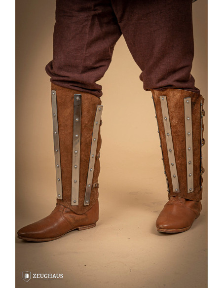 Medieval greaves in steel and split...
