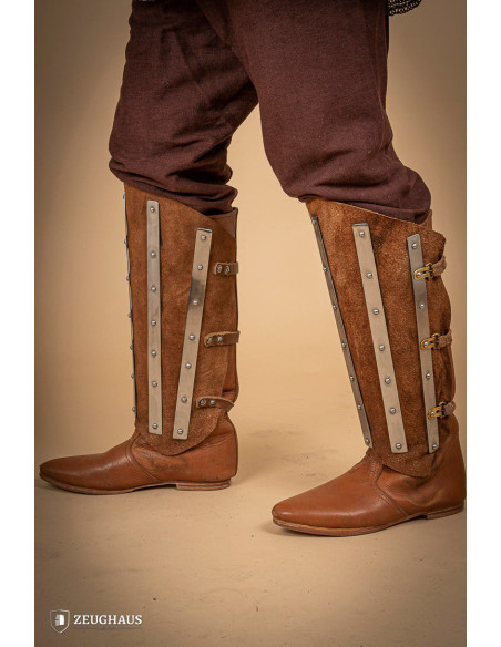 Medieval greaves in steel and split...