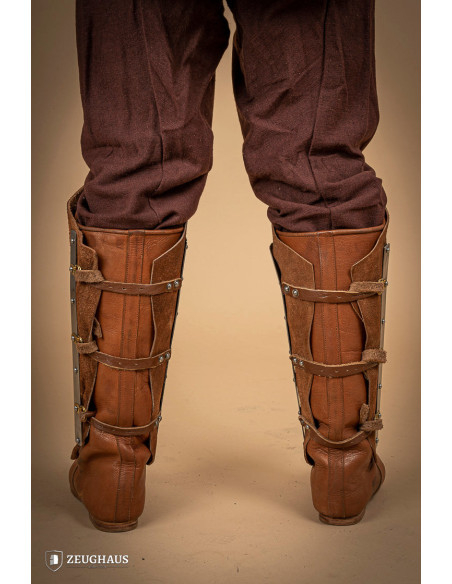 Medieval greaves in steel and split...