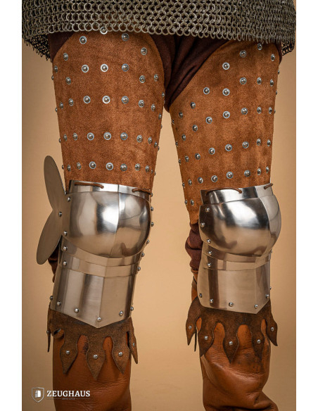 Medieval leg armor in leather and steel