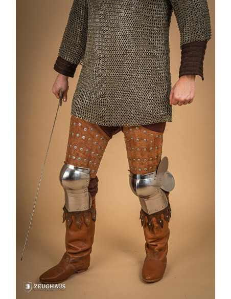Medieval leg armor in leather and steel