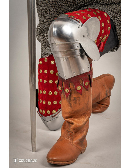 Medieval leg armor in steel and red...