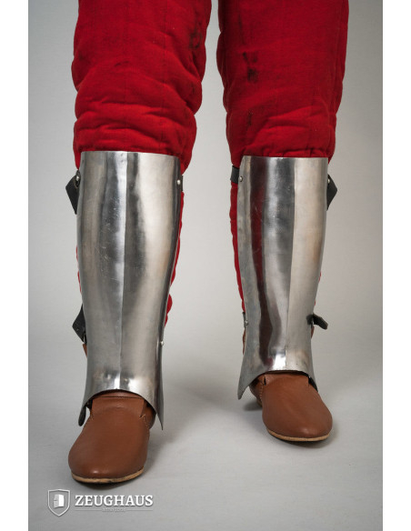Medieval greaves in polished steel,...