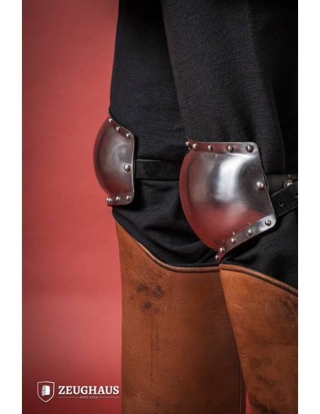 Medieval knee pads in polished steel,...