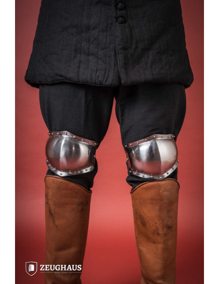 Medieval knee pads in polished steel,...