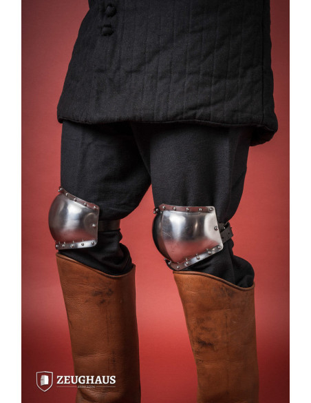 Medieval knee pads in polished steel,...